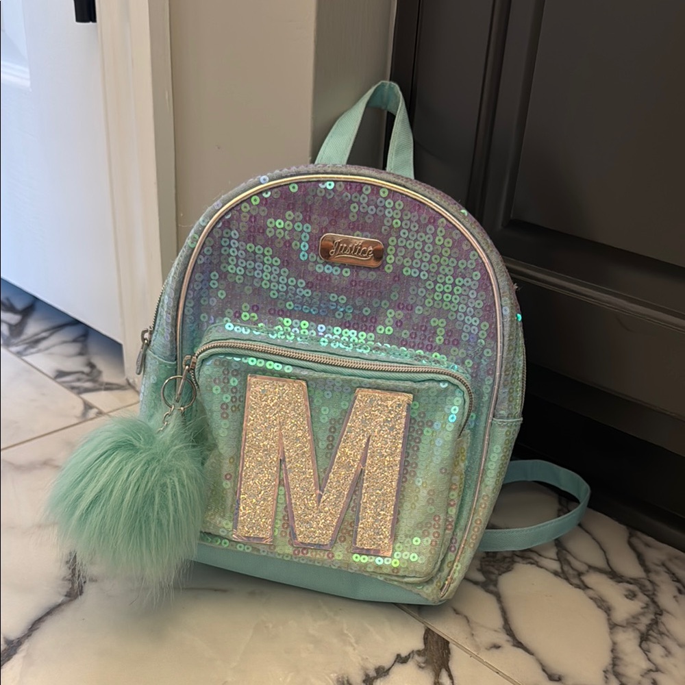 Justice green, purple, and silver Mini backpack with sequin and letter “M”